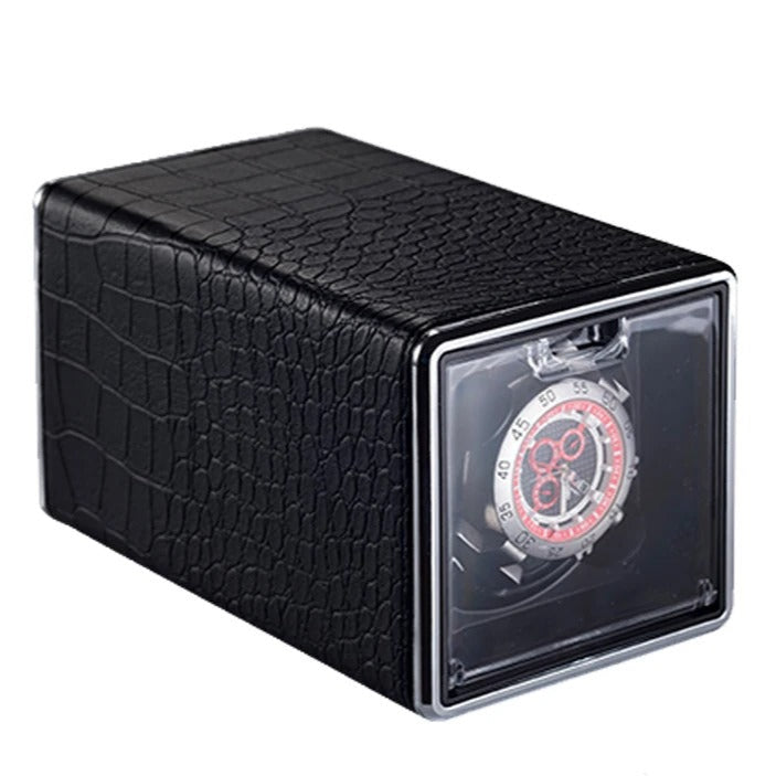 Black crocodile-patterned watch winder with power cord on a white background