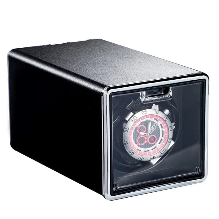 Watch winder with a watch inside on a white background