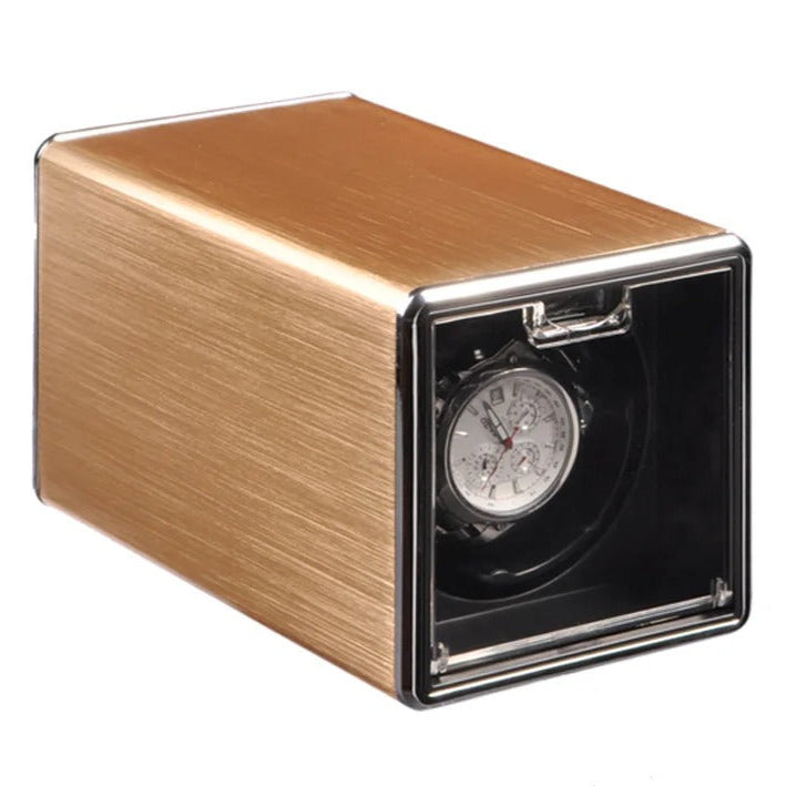 Golden metal watch winder with white background