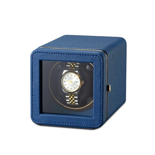 Blue watch winder with a watch inside on a white background