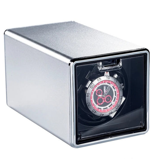 Watch winder with a watch inside on a white background