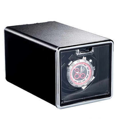 Watch winder with a watch inside on a white background