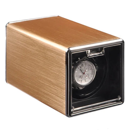 Golden metal watch winder with white background